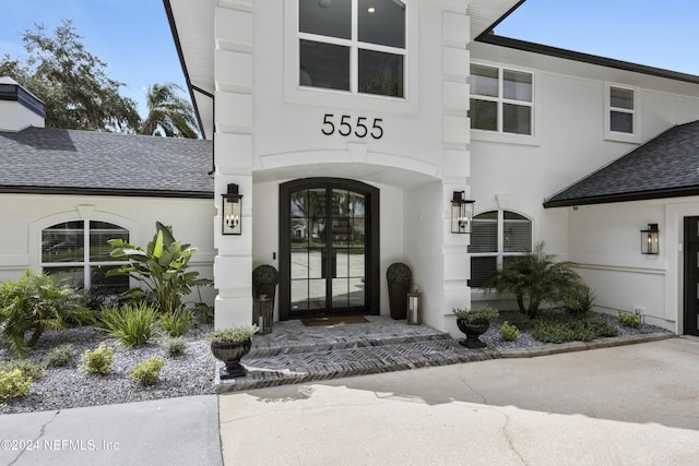 entrance to property featuring french doors