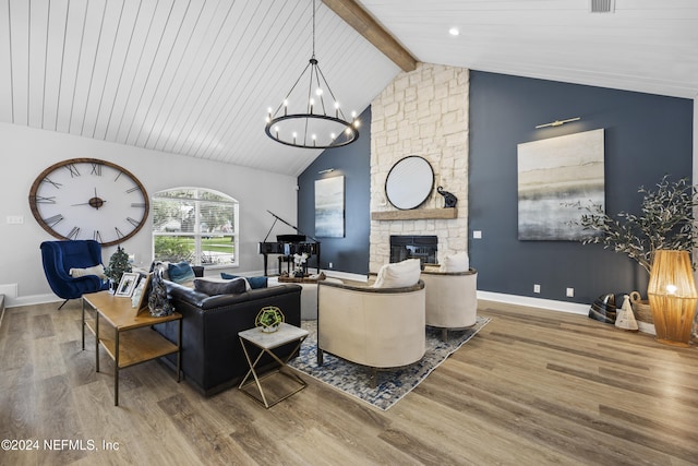 living room featuring a fireplace, beamed ceiling, wood-type flooring, and high vaulted ceiling