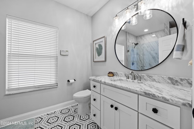 bathroom with tile patterned flooring, vanity, toilet, and a shower with door