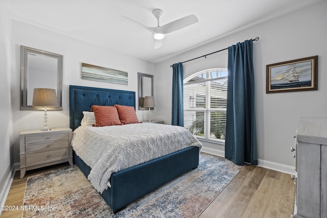 bedroom featuring light hardwood / wood-style floors and ceiling fan