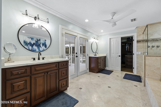 bathroom with ceiling fan, french doors, a textured ceiling, and ornamental molding