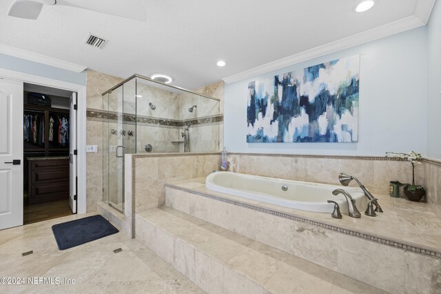 bathroom with crown molding and shower with separate bathtub