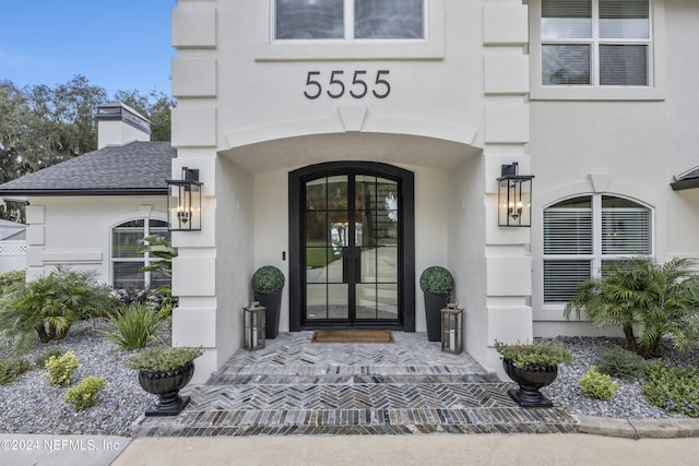 property entrance featuring french doors