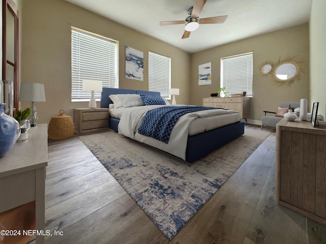 bedroom with light hardwood / wood-style floors and ceiling fan