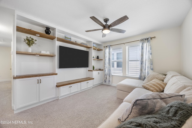 living room featuring ceiling fan and light colored carpet