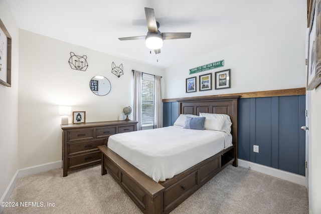 bedroom featuring ceiling fan and light carpet