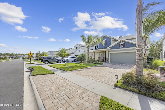 view of front of house featuring a front yard and a garage