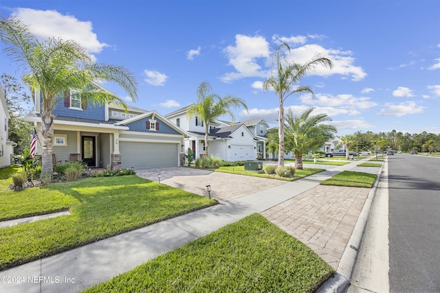 view of front facade with a garage and a front lawn