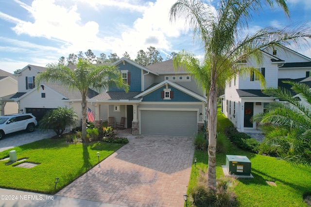 view of front facade with a garage and a front yard