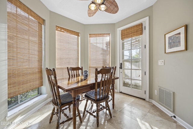 dining area featuring ceiling fan and plenty of natural light