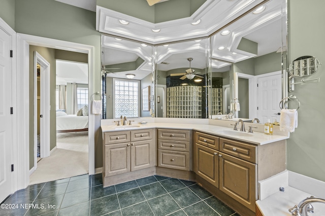 bathroom with tile patterned floors, vanity, ceiling fan, crown molding, and a tub