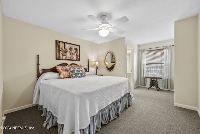 carpeted bedroom featuring ceiling fan and ensuite bath