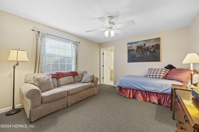 bedroom with ceiling fan, carpet floors, and ensuite bath