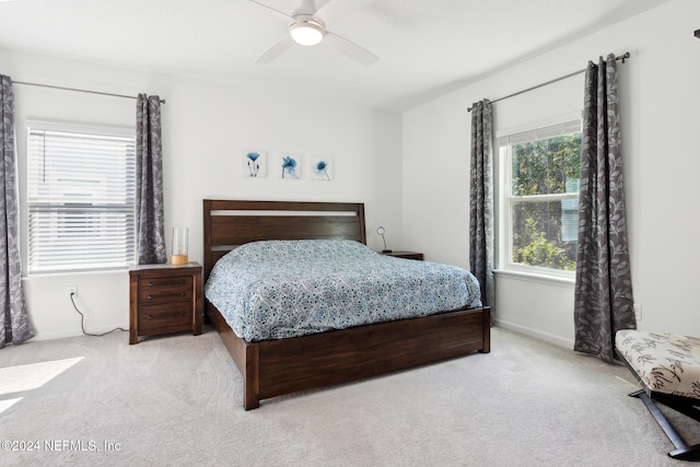 bedroom featuring ceiling fan and light colored carpet