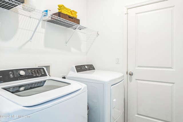 washroom with independent washer and dryer