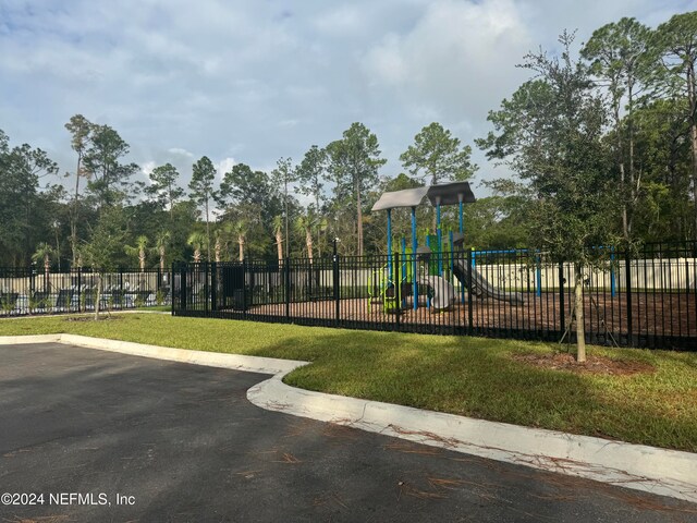 view of jungle gym featuring a yard