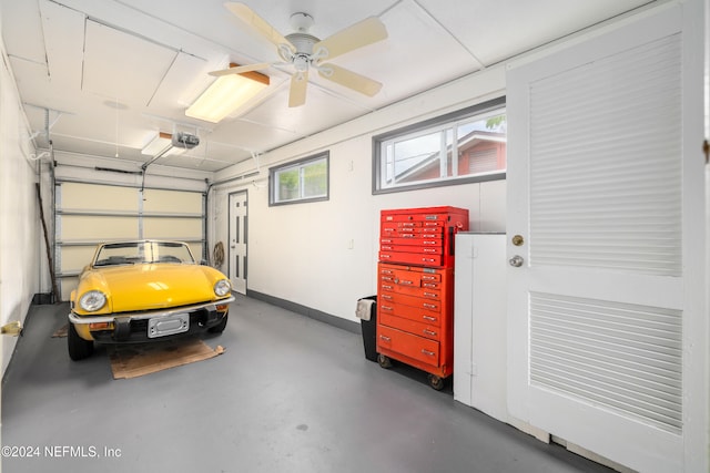 garage with ceiling fan and a garage door opener