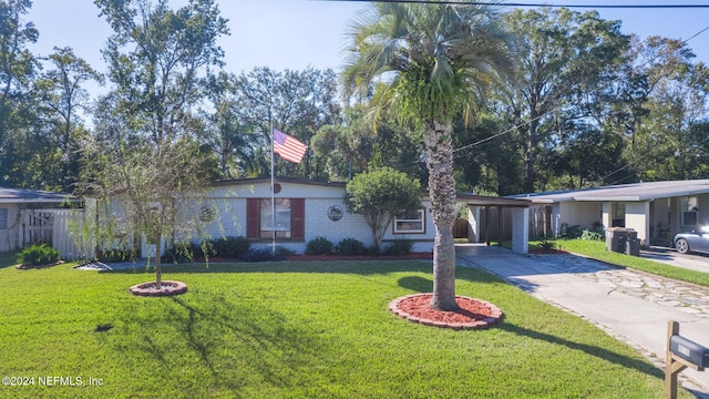 single story home featuring a front yard and a carport