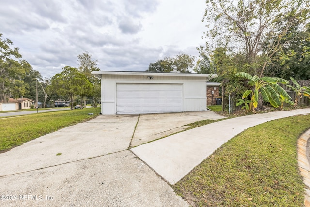 garage featuring a yard