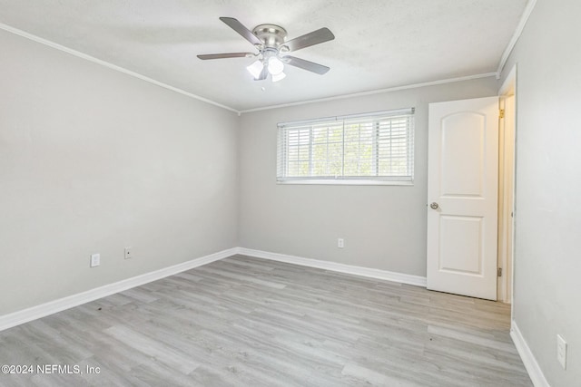 unfurnished room with light hardwood / wood-style flooring, ceiling fan, and crown molding