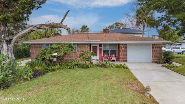 ranch-style home featuring a garage and a front lawn