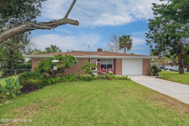 ranch-style house featuring a front lawn and a garage