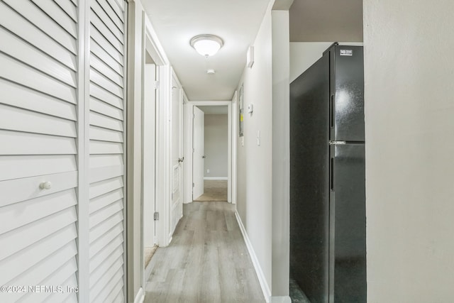 hallway featuring light wood-type flooring