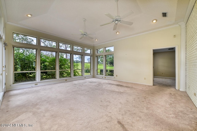 unfurnished sunroom featuring ceiling fan