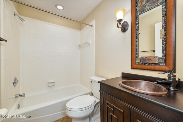 full bathroom featuring vanity, toilet, and tiled shower / bath