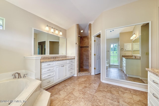 bathroom with shower with separate bathtub and vanity