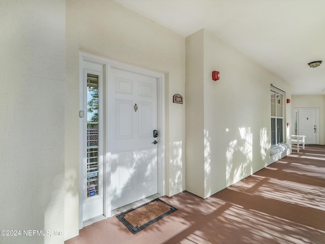 doorway to property featuring covered porch