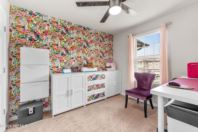 home office featuring ceiling fan and light colored carpet