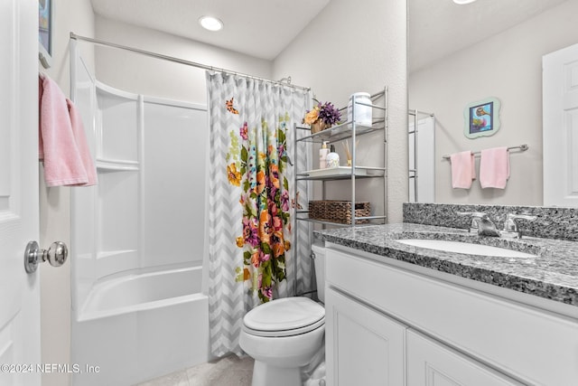 full bathroom with shower / tub combo with curtain, vanity, and toilet