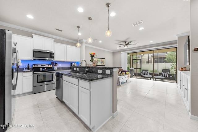 kitchen with stainless steel appliances, white cabinets, and sink