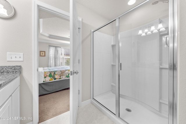 bathroom featuring walk in shower, vanity, and ornamental molding