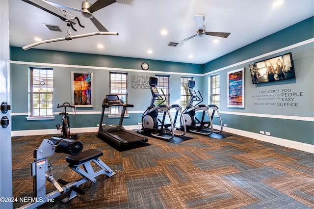 exercise room with carpet flooring and ceiling fan