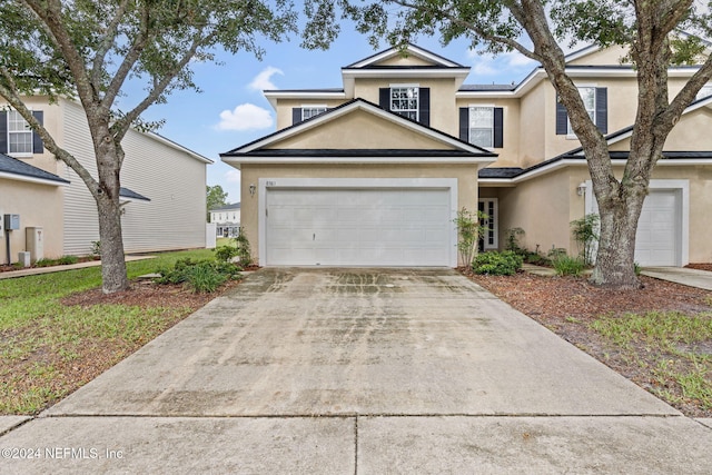 front of property featuring a garage