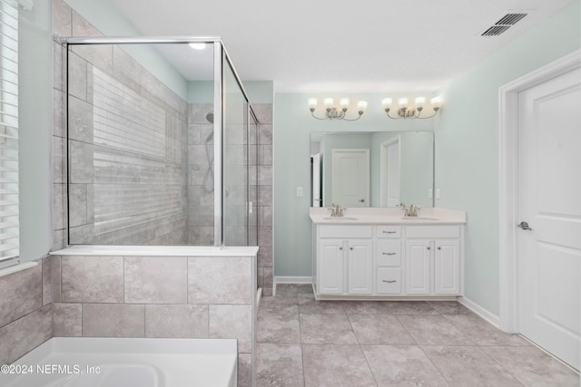 bathroom with shower with separate bathtub, vanity, and tile patterned floors