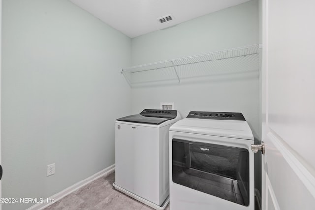 laundry room featuring separate washer and dryer