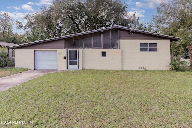 ranch-style house with a sunroom, a garage, and a front lawn