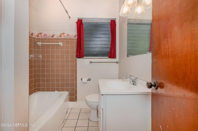 full bathroom with tile patterned flooring, vanity, toilet, and tiled shower / bath