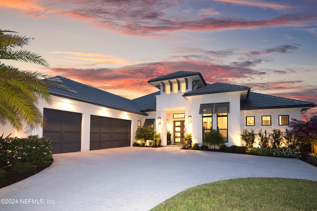 view of front of house with french doors and a garage