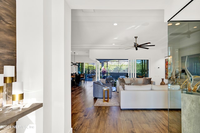 living room featuring hardwood / wood-style flooring and ceiling fan