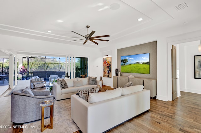 living room featuring ceiling fan and light wood-type flooring