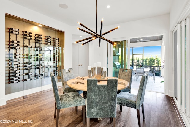 dining room featuring hardwood / wood-style floors and a notable chandelier