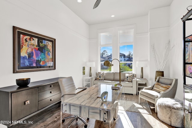 home office featuring ceiling fan and dark wood-type flooring