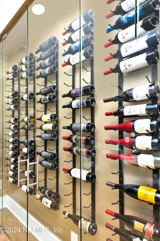 wine cellar with hardwood / wood-style floors