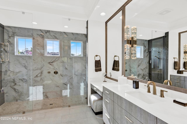 bathroom with tile patterned flooring, vanity, and an enclosed shower