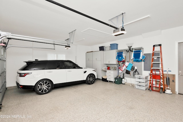 garage featuring a garage door opener