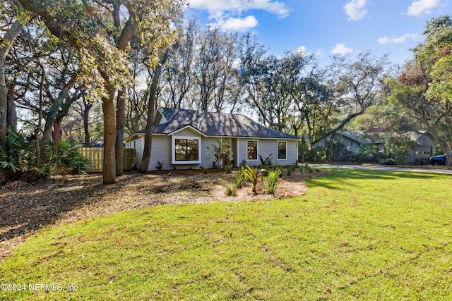 ranch-style house with a front lawn